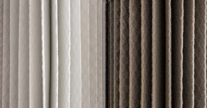 Side by side image of a clean and dirty air filter. A dirty or overfull air conditioner could be a reason your HVAC not cooling?