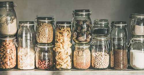 Image: food decanted in mason jars.